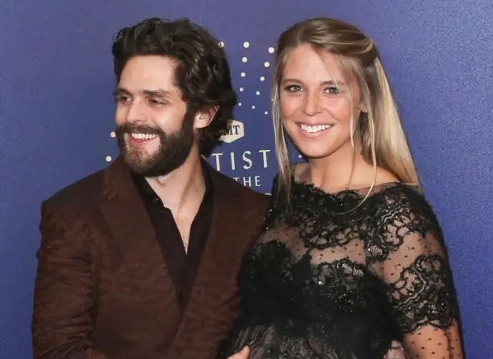 Thomas Rhett (L) and wife Lauren Akins attend the 2019 CMT Artists of the Year at Schermerhorn Symphony Center on October 16^ 2019 in Nashville^ Tennessee.