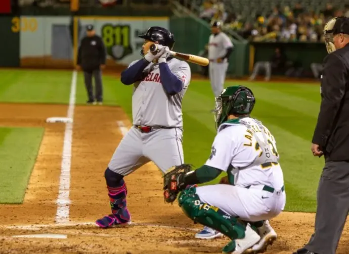 Oakland^ California - March 28^ 2024: Cleveland Guardians first baseman Josh Naylor bats against the Oakland Athletics on Opening Day at the Oakland Coliseum.