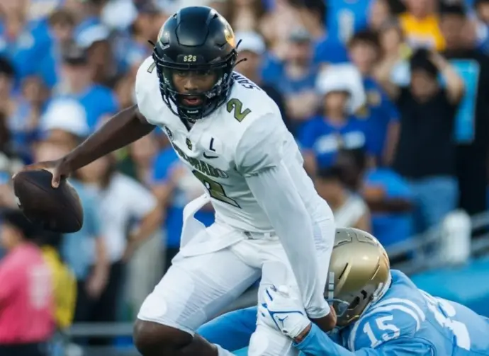 Colorado quarterback Shedeur Sanders #2 is tackled by UCLA defensive line Laiatu Latu #15 during an NCAA college football game between the UCLA and the Colorado^ Oct. 28^ 2023^ in Pasadena^ Calif.