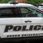 A police car in Brown University campus in Providence^ RI^ USA^ on November 10^ 2023. Brown University is a private Ivy League research university in Providence^ Rhode Island.
