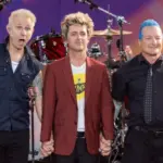 Mike Dirnt^ Billie Joe Armstrong^ Tre Cool pose on stage during ABC Good Morning America rock group Green Day concert in Central Park in New York on July 26^ 2024