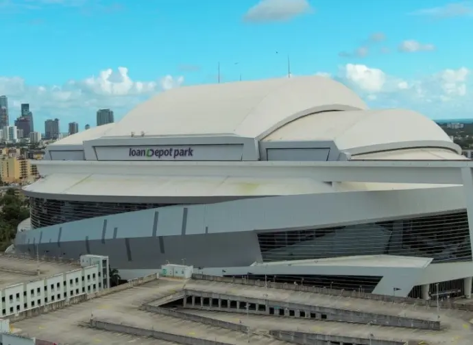 Aerial shot of LoanDepot Park with skyscrapers and office buildings in the city skyline^ lush green palm trees and cars on the street in Miami Florida USA Miami Florida USA - 11 -12-2024