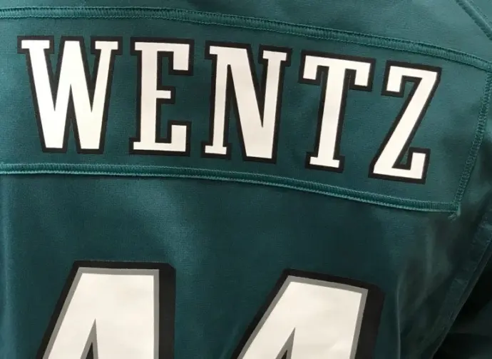 A fan wears the jersey of injured Eagles quarterback Carson Wentz in a mall. Minneapolis^ MN/USA- February 1^ 2018