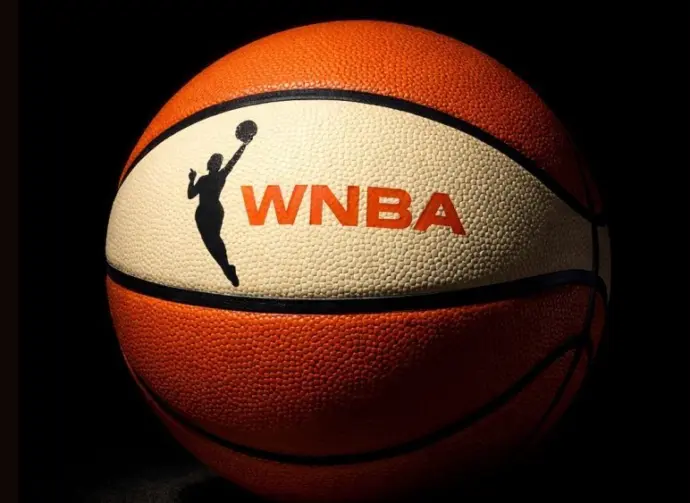 Generate a basketball with the WNBA logo^ the background must be completely black but the ball must be illuminated artistically.
