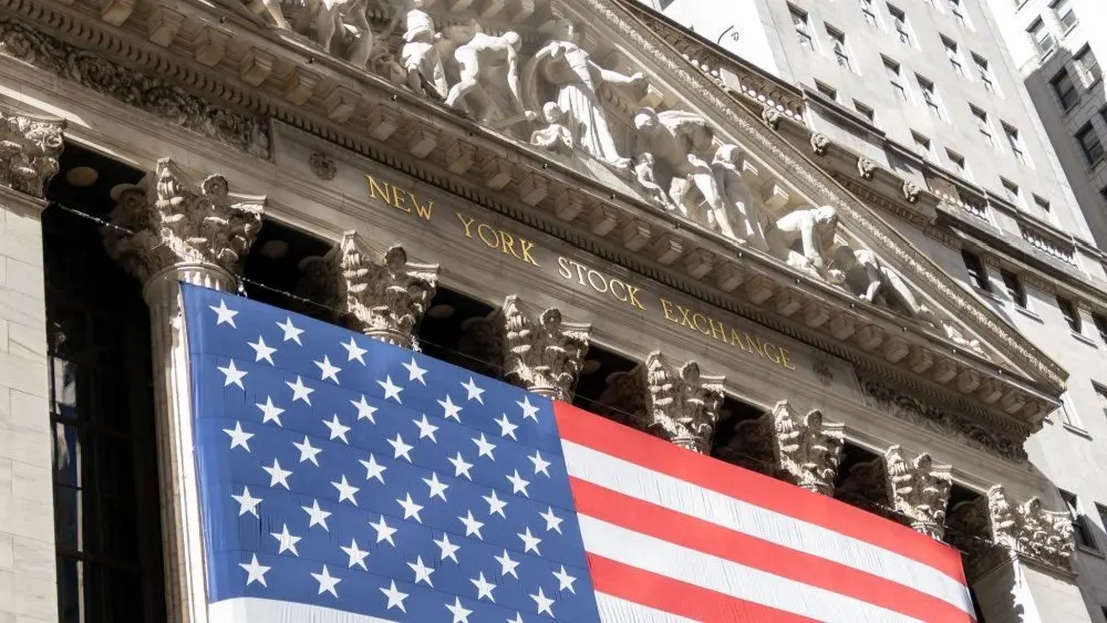 Grand American flag displayed on the facade of the New York Stock Exchange in downtown Manhattan. New York^ NY^ USA - 11.05.2024