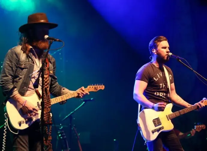NEW YORK-MAY 6: Singers T.J. Osborne (R) and John Osborne of Brothers Osborne perform onstage at the Paramount on May 6^ 2016 in Huntington^ New York.