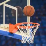 A basketball flying into the basket