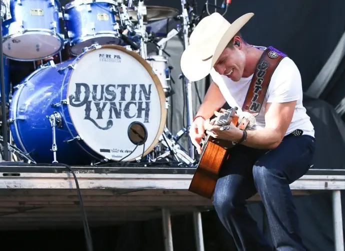 Dustin Lynch performs during the 'Kick The Dust Up' Tour at Vanderbilt Stadium on July 11^ 2015 in Nashville^ Tennessee.