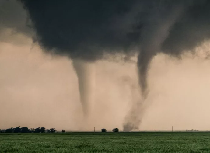 A pair of tornadoes take a destructive path through northern Oklahoma farmyards near Cherokee