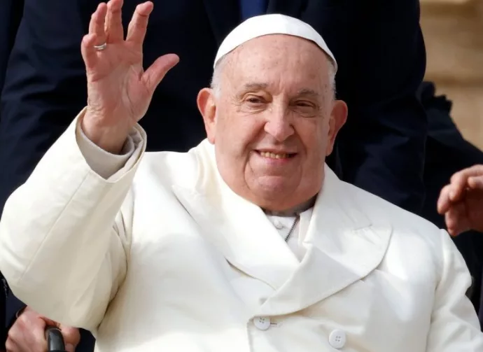 Pope Francis waves to the faithful at the end of his weekly general audience in St. PeterÕs Square at the Vatican^ November 13^ 2024.