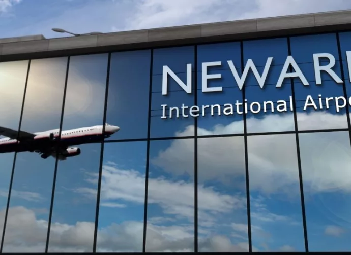 Aircraft landing at Newark^ New Jersey^ USA 3D rendering illustration. Arrival in the city with the glass airport terminal and reflection of jet plane. Travel^ business^ tourism and transport.