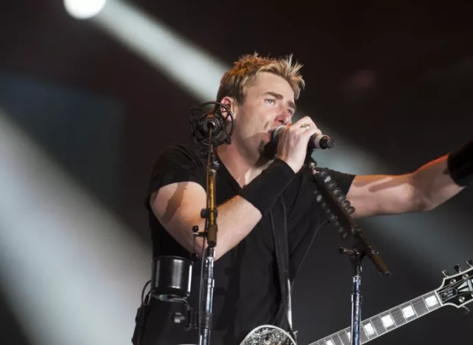 Chad Kroeger^ lead vocalist of the Canadian band Nickelback^ performs during the Rock in Rio 2013 concert^ on September 20^ 2013 in Rio de Janeiro^ Brazil.