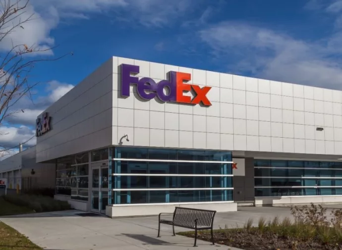 FedEx logo on the building of FedEx Ship Centre in Toronto. TORONTO^ CANADA - NOVEMBER 19^ 2017