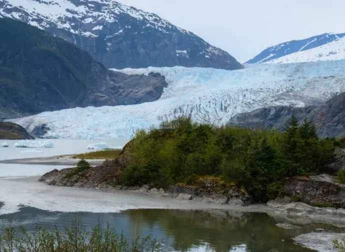 Tourist visiting Mendenhall Glacier. Juneau. Alaska.