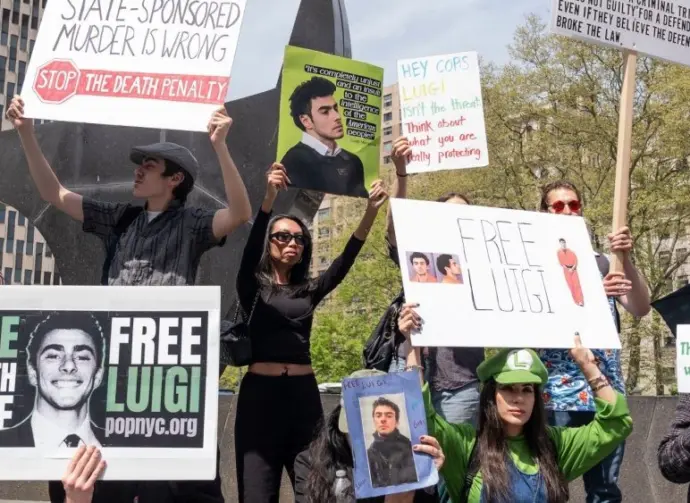 Activists gathered in front of Federal Court where Luigi Mangione was arraigned on Federal Charges accusing him of killing United HealthCare CEO Brian Thompson New York - April 25^ 2025