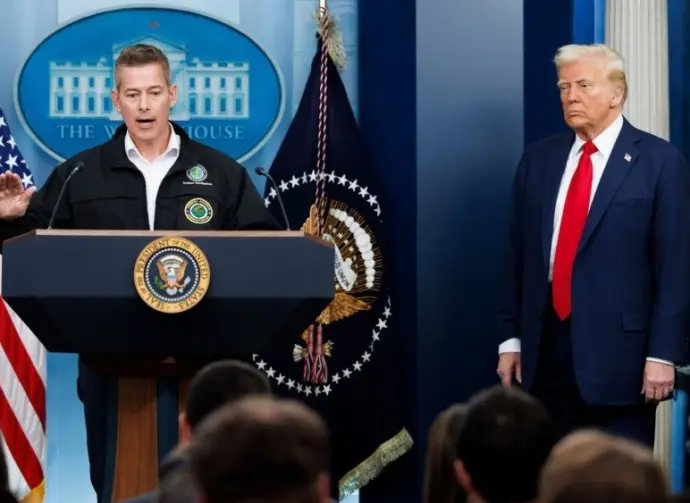 Sean Duffy^ Transportation Secretary^ speaks at a White House press briefing. Pres. Donald Trump also pictured