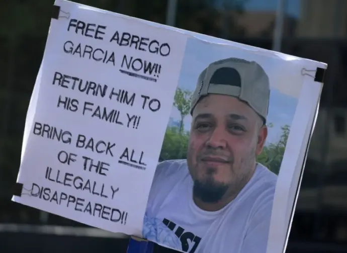 protest sign reading: "Free Abrego Garcia Now" Return Him To his family! Bring back all of the illegally disappeared! NEW YORK^ NEW YORK USA - May 1^ 2025 on International Workers' Day in Lower Manhattan.