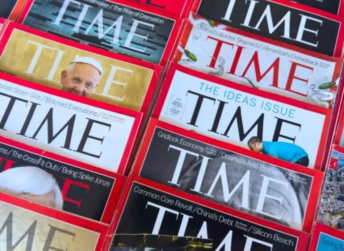 Colorful close-up of overlapping TIME Magazine covers^ highlighting diverse headlines on world leaders^ politics^ business^ and social issues. Calgary^ Alberta^ Canada. Dec 1^ 2025