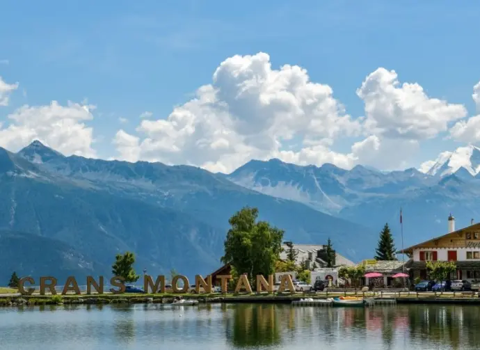 Big letters near lake spelling out Crans Montana in Switzerland during August 2020 Crans-Montana^ Switzerland - August 10^ 2020