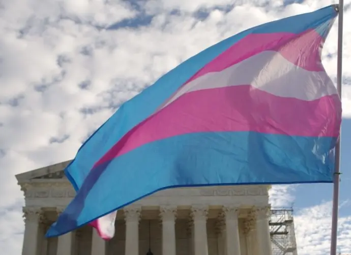 A transgender pride flag flies in front of the U.S. Supreme Court building in Washington^ DC.