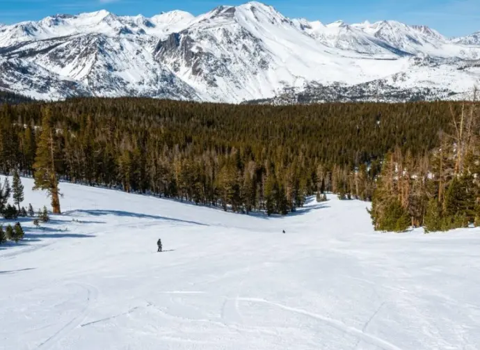 Unknown skiers have the hill to themselves at June Mountain Ski Resort^ a small resort tucked away in the Eastern Sierra Nevada mountains in California.