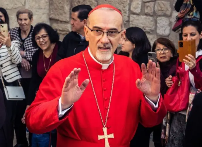 Cardinal Pierbattista Pizzaballa^ Latin Patriarch of Jerusalem^ greets the crowd as he leaves the Church of the Nativity after the Christmas celebrations. Bethlehem^ West Bank^ December 25^ 2025