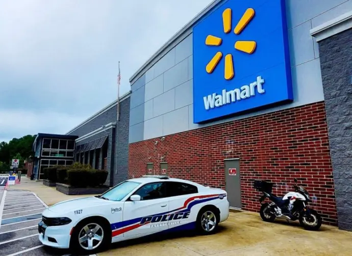 Police car parked in front of Walmart Store^ Fayetteville^ North Carolina^ USA^ August 6^ 2025