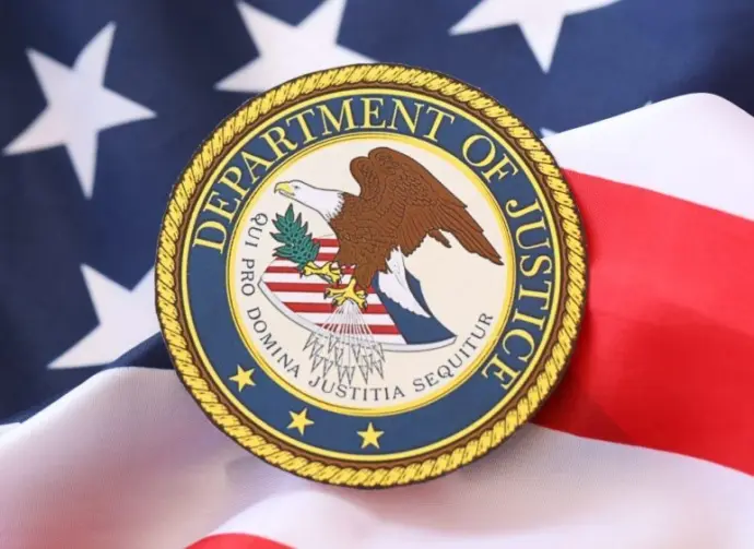 US Department of Justice seal on United States of America flag close up