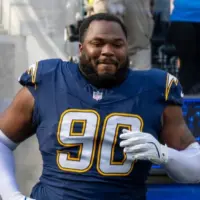 Los Angeles Chargers defensive lineman Teair Tart #90 runs into field before an NFL football game against the Houston Texans at SoFi Stadium^ Saturday Dec. 27^ 2025^ in Inglewood^ Calif.