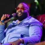 Rick Ross speaking with President A. Zachary Faison Jr. and Guest Host at Edward Waters University JACKSONVILLE FLORIDA - NOVEMBER 3^ 2022