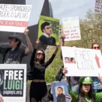 Activists gathered in front of Federal Court where Luigi Mangione was arraigned on Federal Charges accusing him of killing United HealthCare CEO Brian Thompson New York - April 25^ 2025