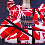 Eddie Van Halen's striped red white black guitar body on a black carpet Hannover^ Germany - December^ 2018