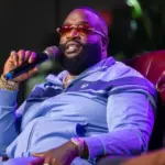 Rick Ross speaking with President A. Zachary Faison Jr. and Guest Host at Edward Waters University JACKSONVILLE FLORIDA - NOVEMBER 3^ 2022