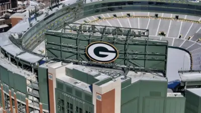 Feb 20^ 2025-Green Bay^ WI; An aerial view of Lambeau Field shows the iconic^ bowl-shaped stadium with its vast seating for 81^441 fans.