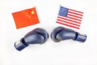 creative-top-view-flat-lay-of-two-boxing-gloves-with-china-and-usa-flag-and-copy-space-on-white-1024x683-1