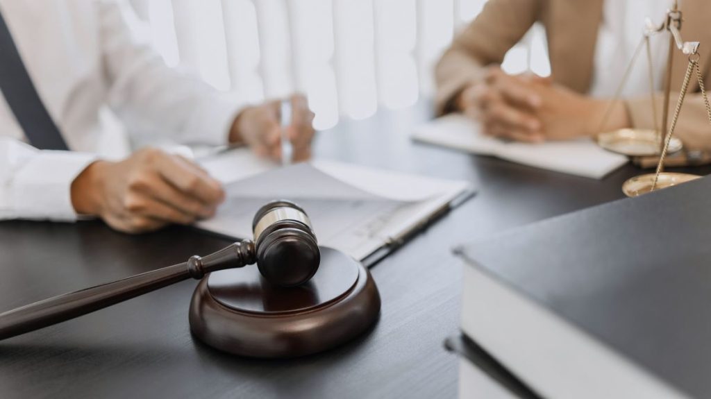 lawyer-working-with-lawsuit-in-courtroom-criminal-and-judgement-concept-1024x575-1-2