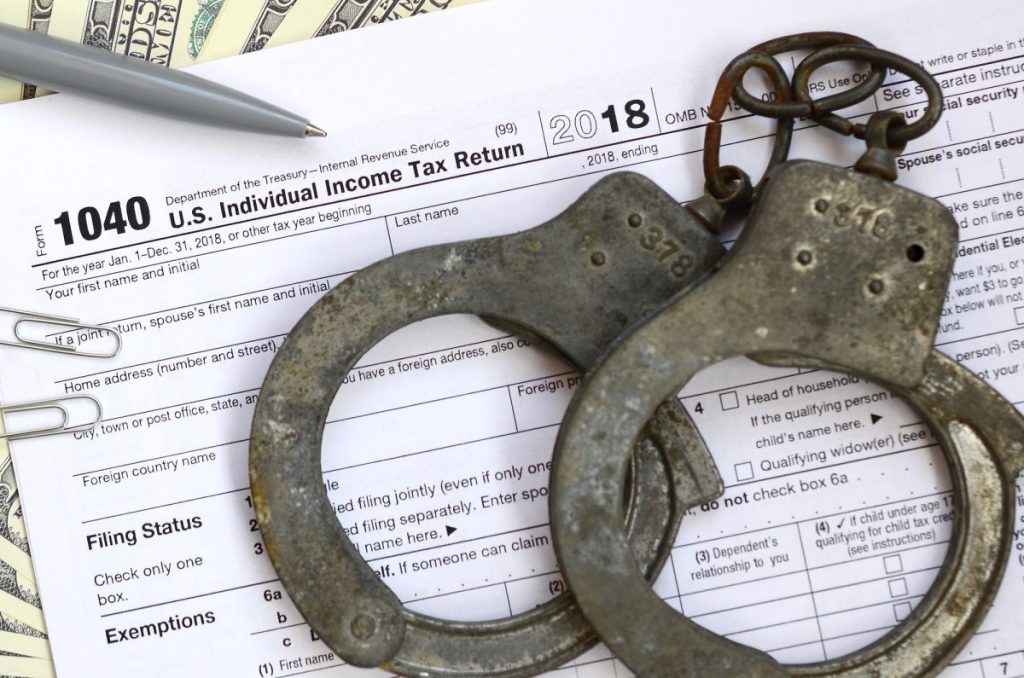 police-handcuffs-lie-on-the-tax-form-1040-1024x678-1