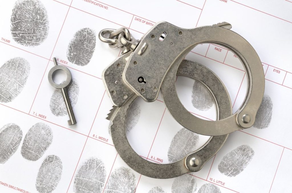 handcuffs-on-fingerprint-sheet-1024x678-1