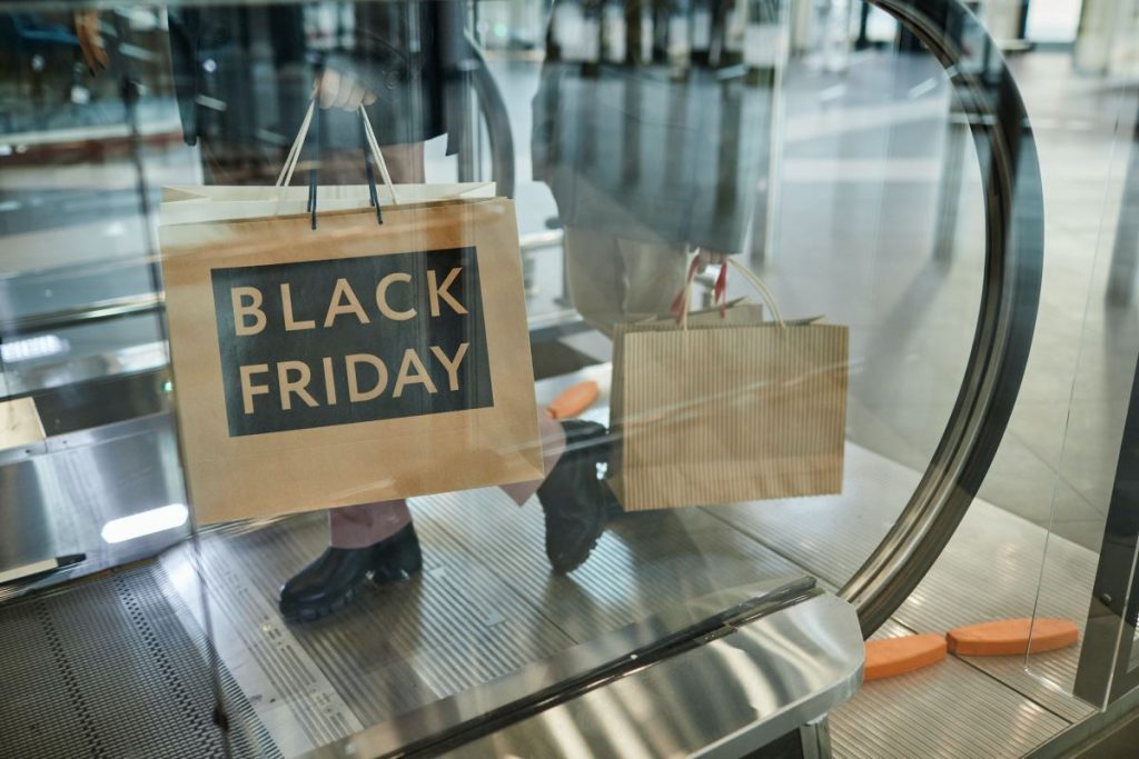 woman-holding-black-friday-shopping-bags-1024x683-1