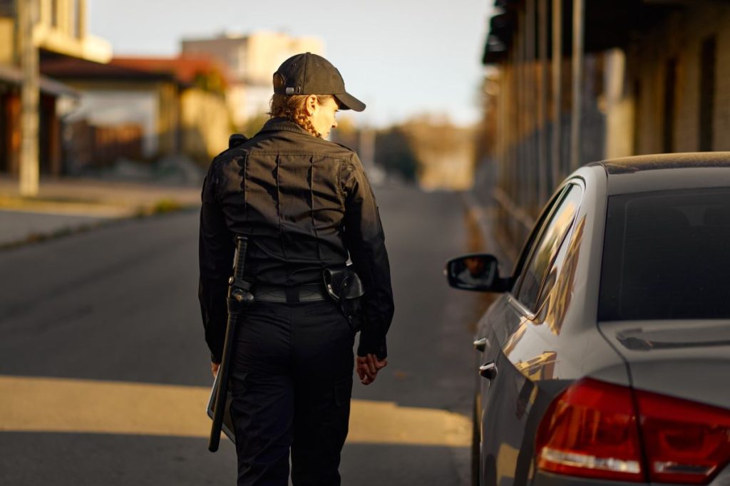 female-cop-coming-to-car-on-road-1024x682979639-1