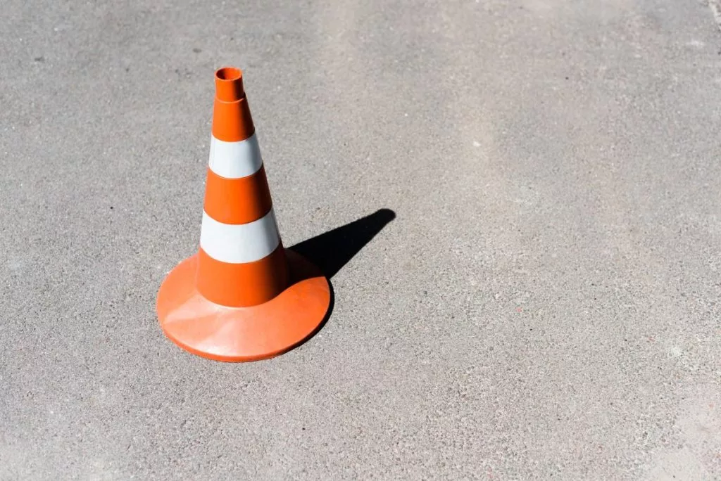 orange-and-white-traffic-cone-on-asphalt-road-1024x684336027-1