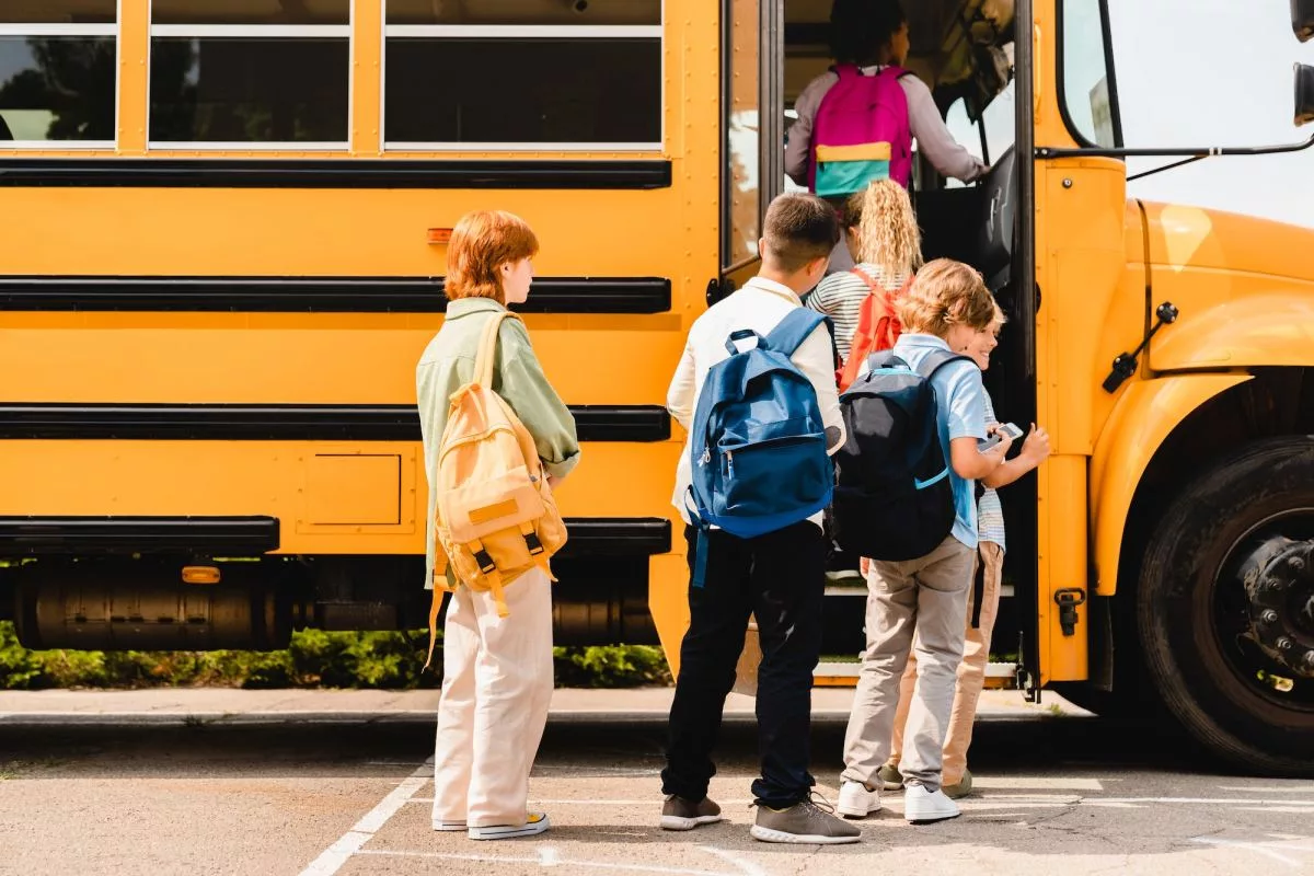 schoolchildren-kids-pupils-group-of-mixed-race-classmates-boarding-school-bus-before-lessons464282