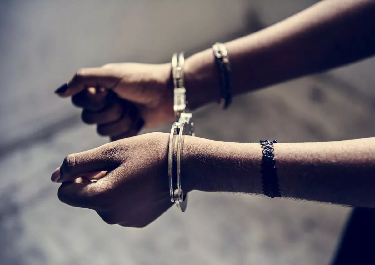 closeup-of-arrested-hands-with-handcuffs573068