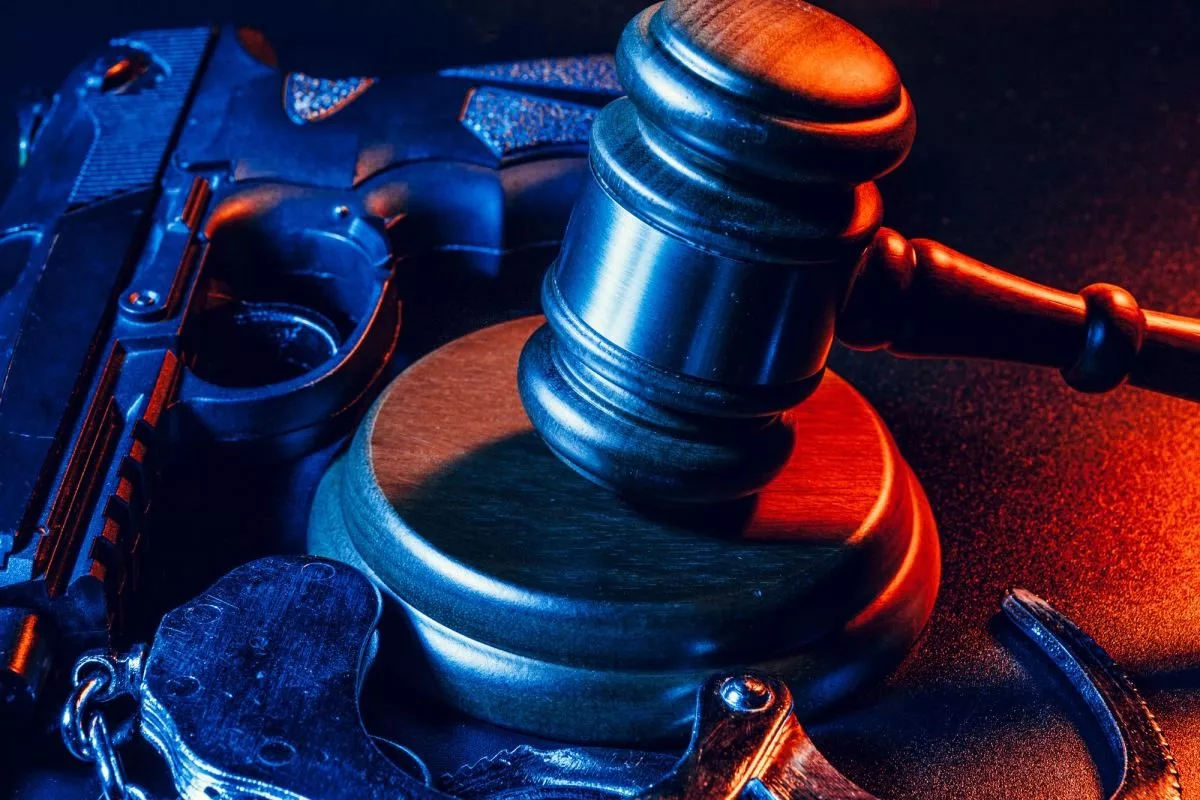 gun-and-judge-s-gavel-on-the-table-crime-robbery-attack-concept311649