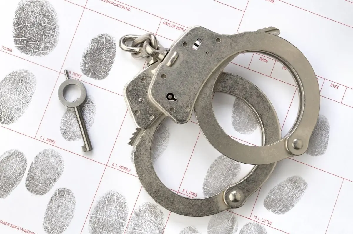handcuffs-on-fingerprint-sheet538282