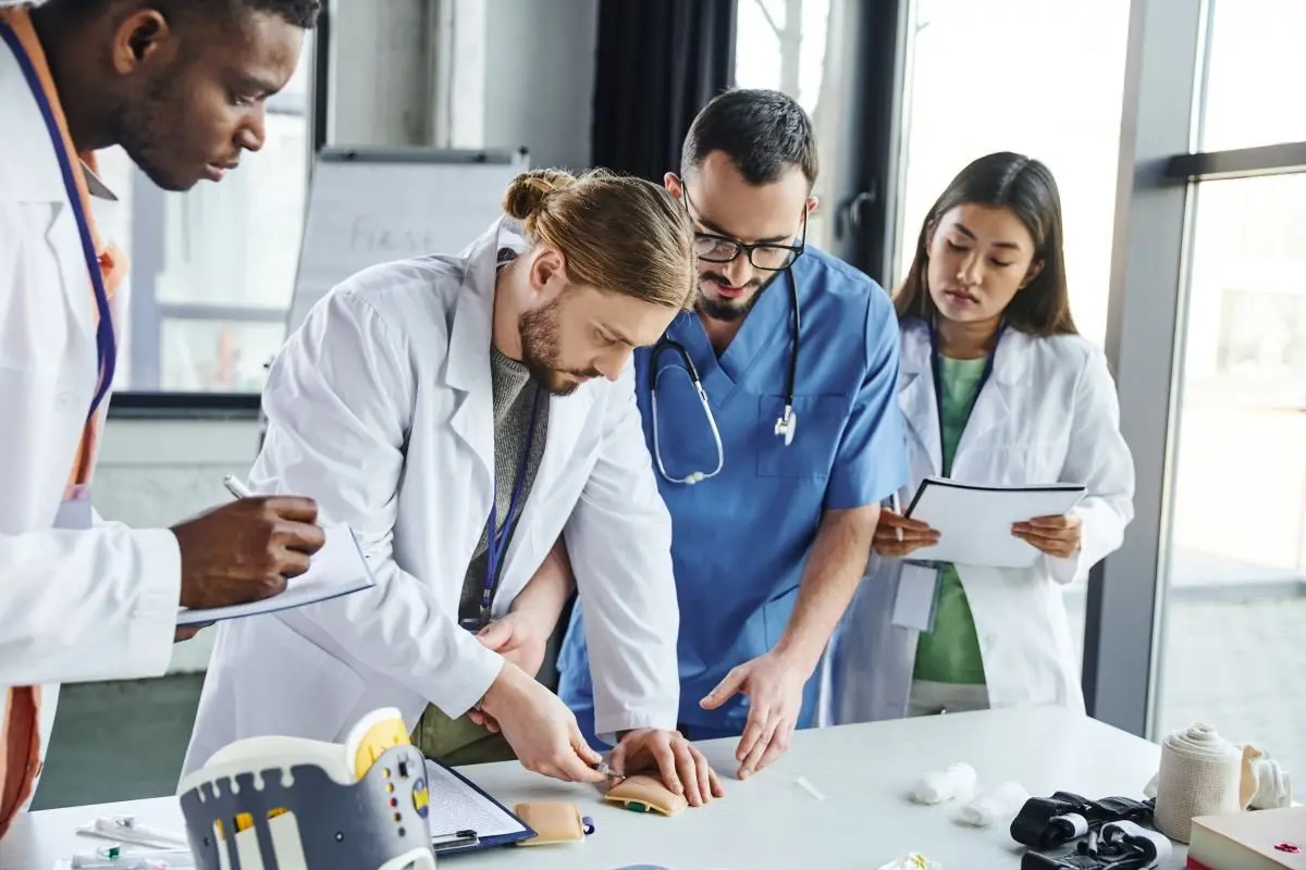 young-student-making-injection-in-training-pad-near-medical-equipment-healthcare-worker269717