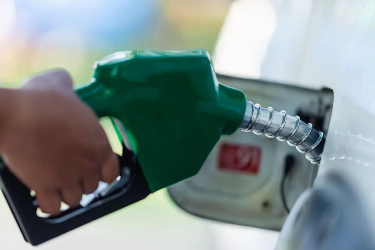 handle-pumping-gasoline-fuel-nozzle-to-refuel-vehicle-fueling-facility-at-petrol-station821403
