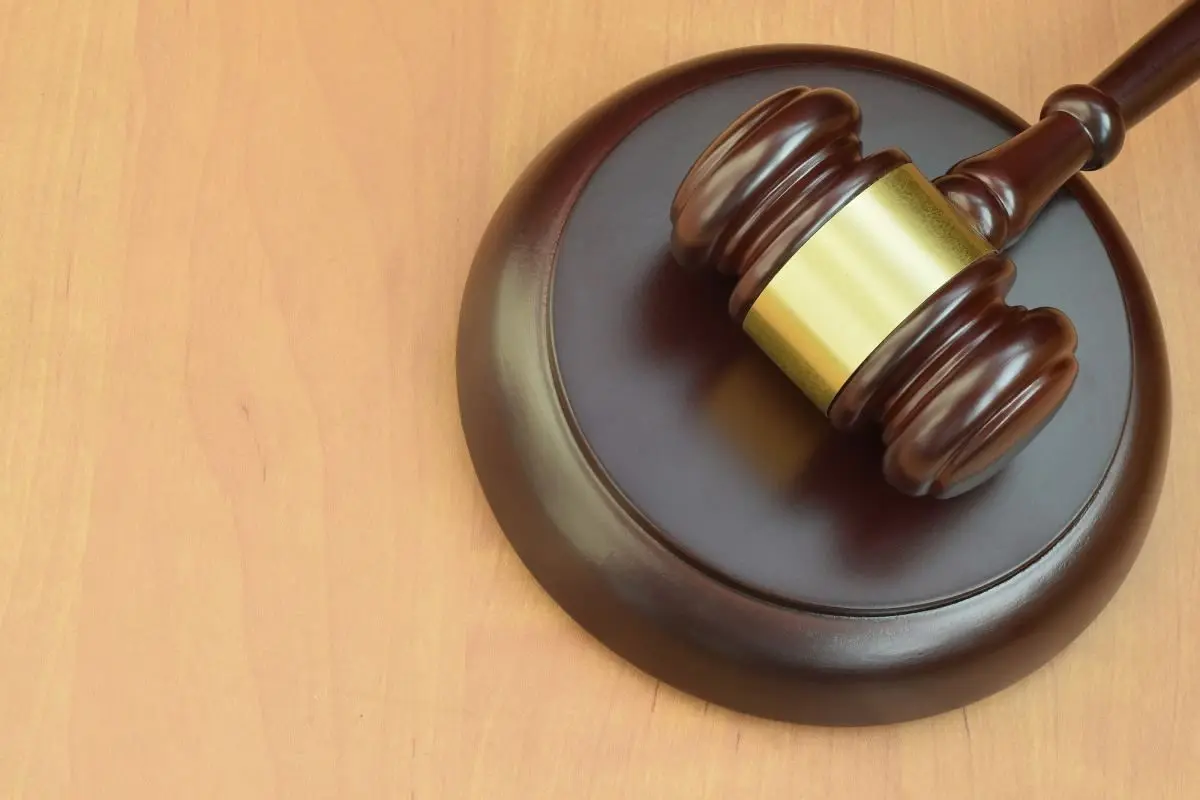 justice-mallet-on-wooden-desk-in-a-courtroom-during-a-judicial-trial169424
