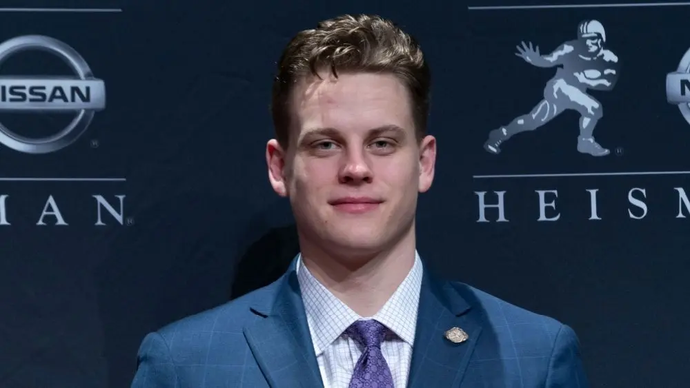Quarterback Joe Burrow of the LSU Tigers winner of the 85th annual Heisman Memorial Trophy poses with trophy at the Marriott Marquis Hotel New York^ NY - December 14^ 2019
