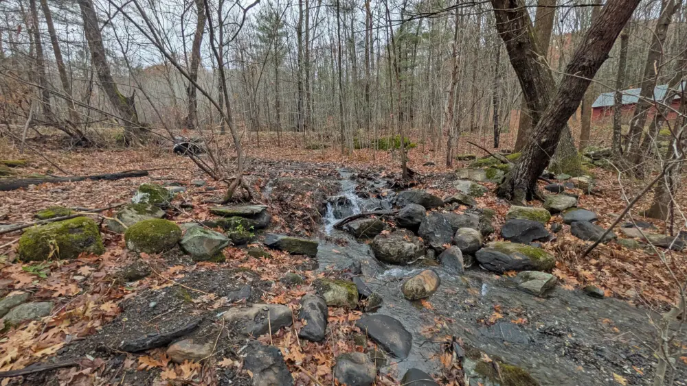 4-winooski-river-tributary-flowing-freely-after-stone-dam-was-removed-top-of-new-culvert-visible-in-background9821
